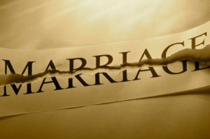 Torn paper with the word marriage for no record of marriage authentication