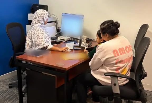 Notaries Nooriyah R. and Sarah D. reviewing business documents at the Apostille Authentications office in Lake Oswego, Oregon
